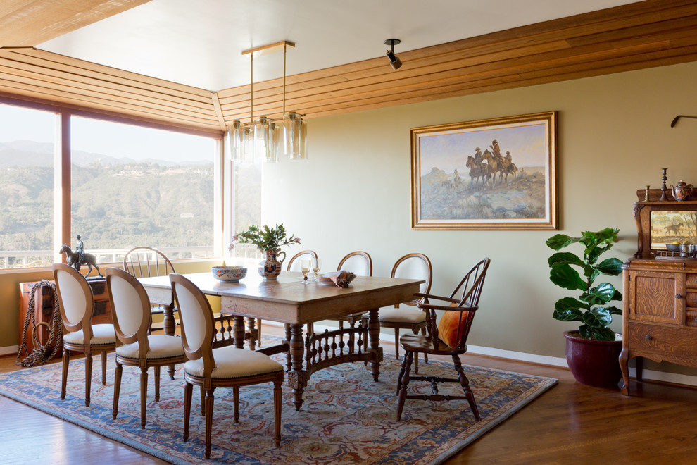 Inspiration for a midcentury dining room in Santa Barbara with medium hardwood flooring and beige walls.