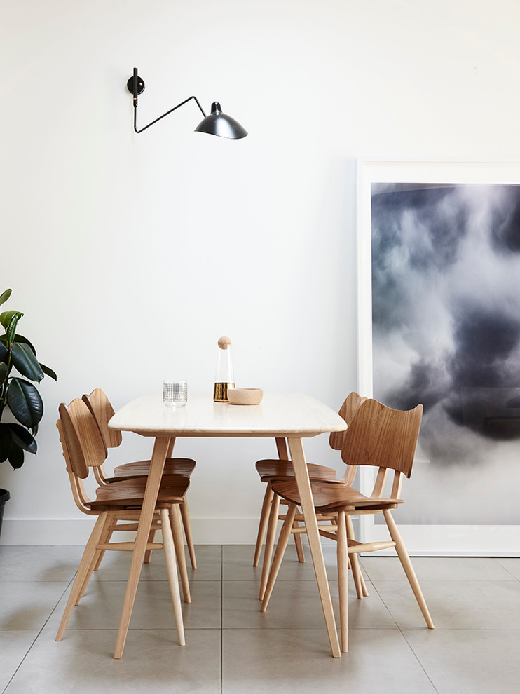 Inspiration for a mid-century modern dining room remodel in Melbourne with white walls