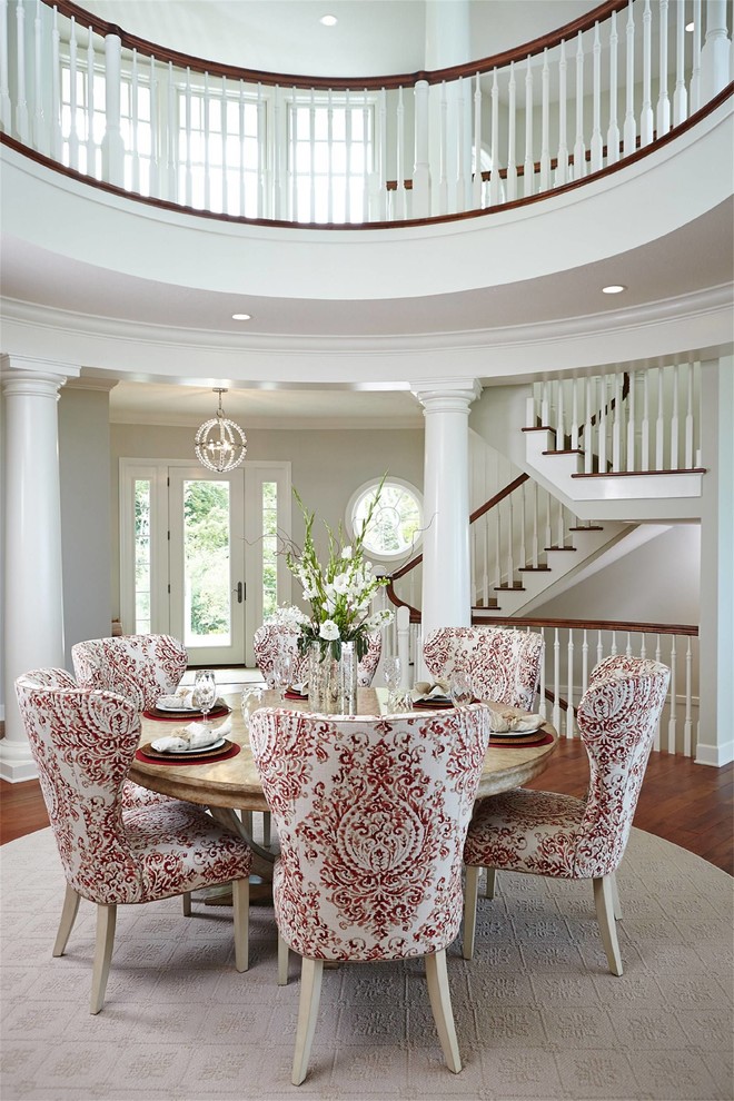 Photo of a large coastal dining room in New York with grey walls, medium hardwood flooring and brown floors.