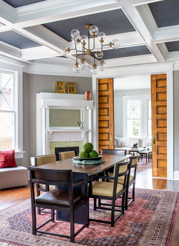 Inspiration for a transitional dark wood floor and brown floor dining room remodel in Atlanta with gray walls