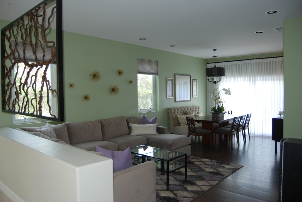 Example of a large transitional porcelain tile great room design in Orange County with green walls