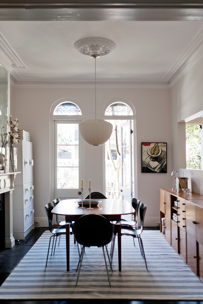 Design ideas for a scandinavian enclosed dining room in Sydney with beige walls.