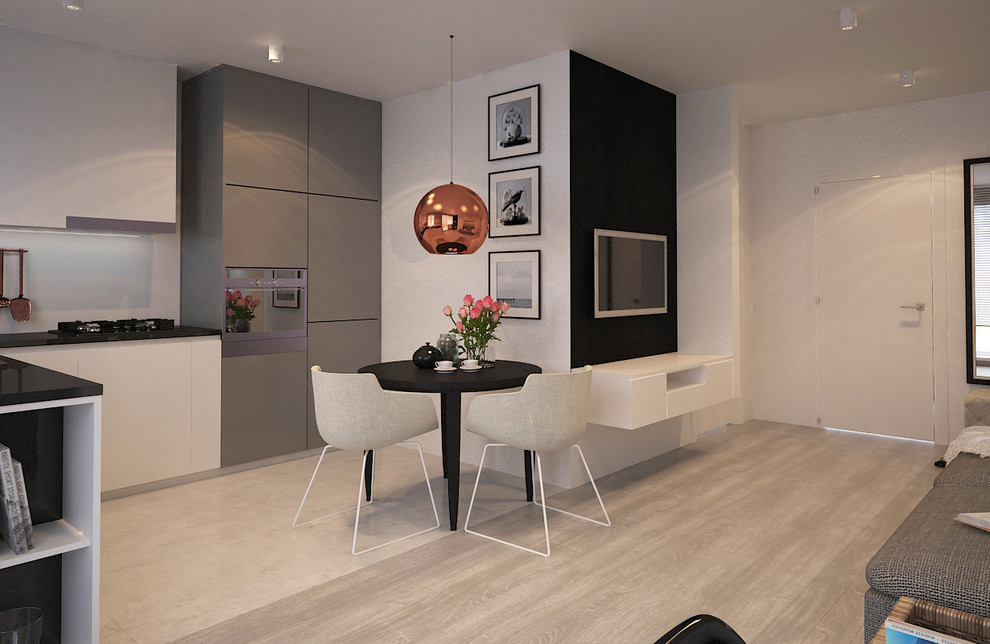 Aménagement d'une petite salle à manger ouverte sur la cuisine contemporaine avec un mur blanc.