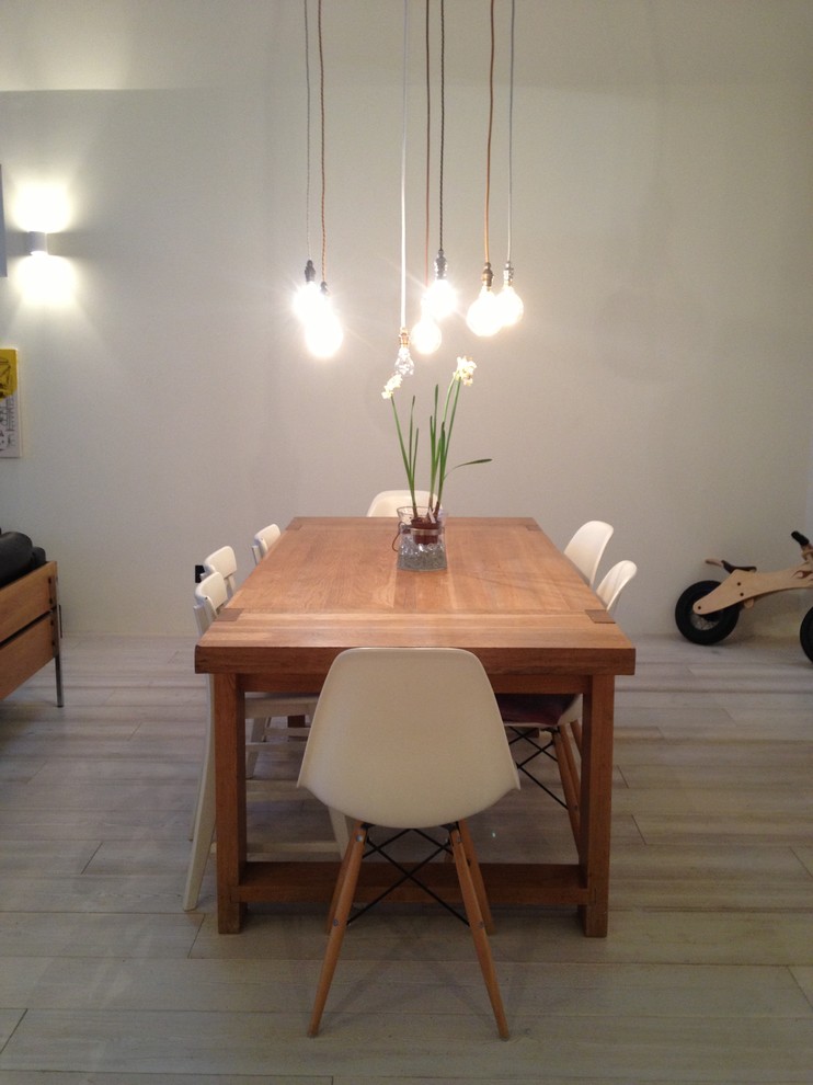 Photo of a contemporary dining room in Manchester with white walls.