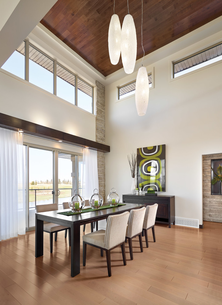 Inspiration for a large modern medium tone wood floor kitchen/dining room combo remodel in New York with white walls
