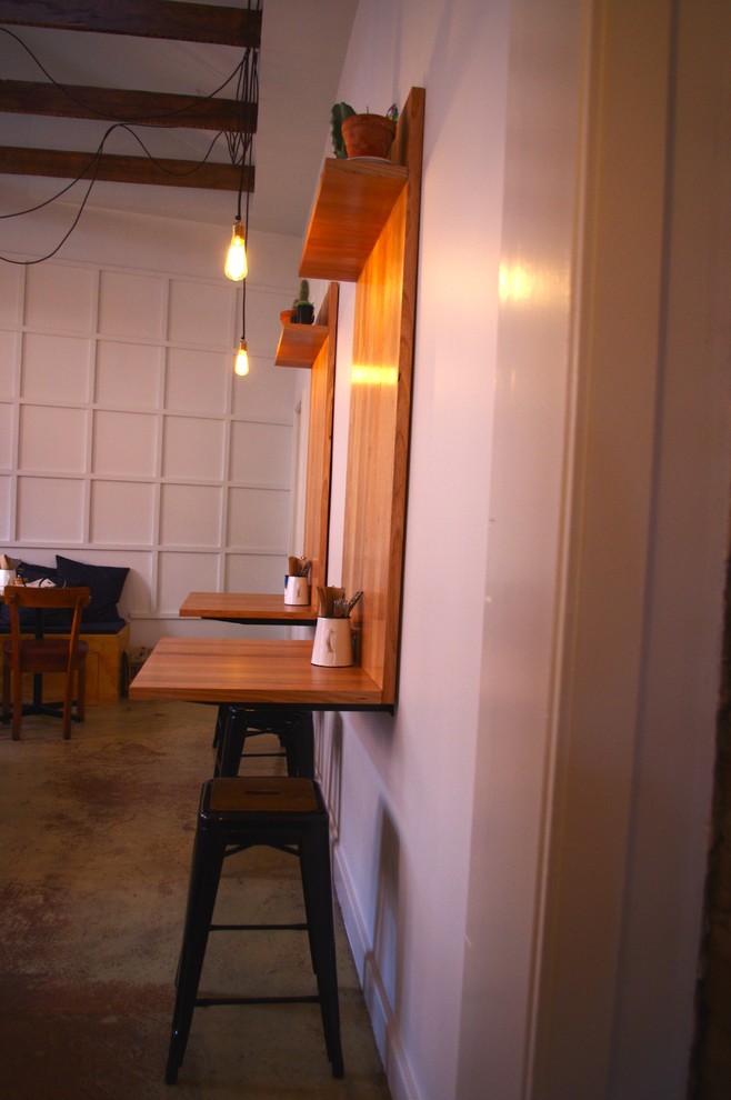 Photo of a medium sized industrial dining room in Melbourne.