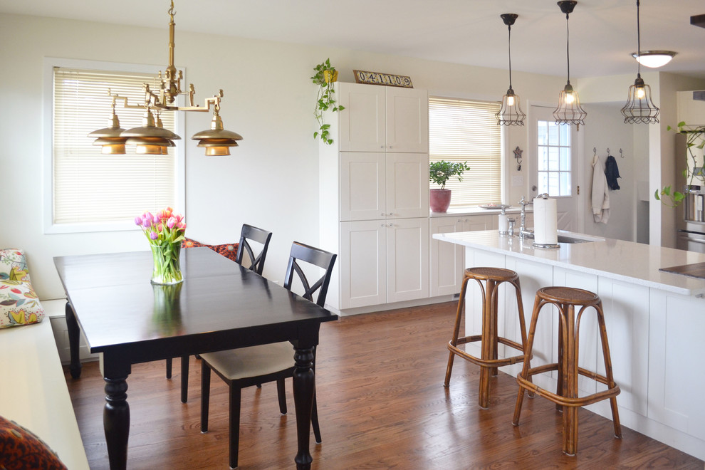 Kitchen/dining room combo - traditional medium tone wood floor kitchen/dining room combo idea in Chicago with white walls
