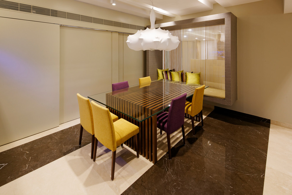 Example of a transitional dining room design in Bengaluru