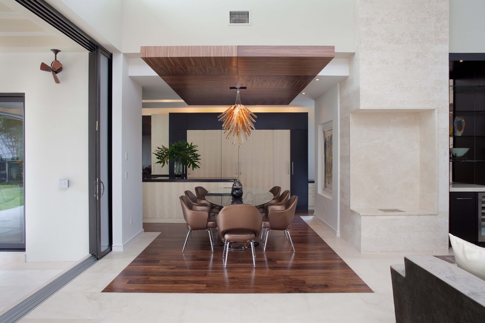Inspiration for a modern dining room remodel in Orlando with white walls