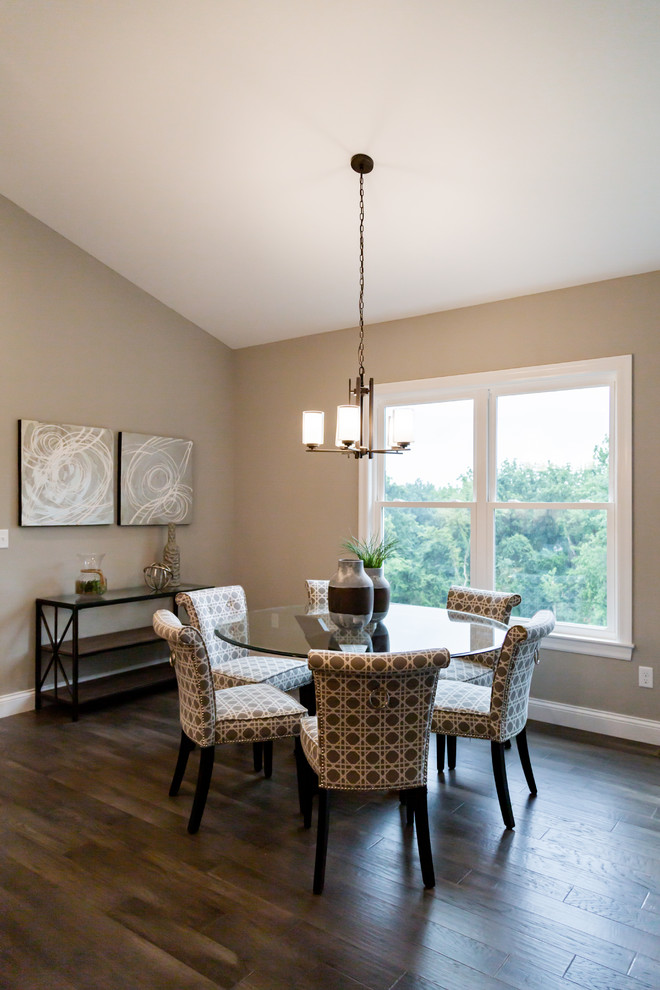 Medium sized classic open plan dining room in St Louis with beige walls, dark hardwood flooring and brown floors.