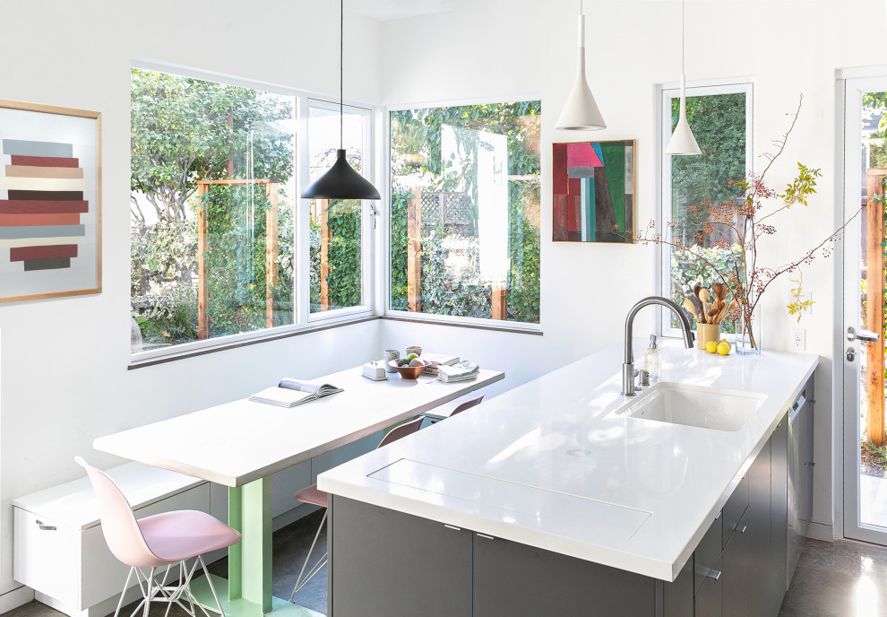 Inspiration for a contemporary concrete floor and gray floor breakfast nook remodel in San Francisco with white walls
