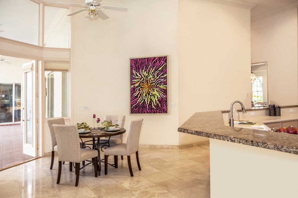 This is an example of an expansive contemporary kitchen/dining room in Tampa with beige walls, travertine flooring and beige floors.