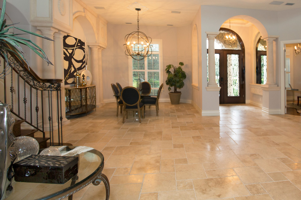 Design ideas for an expansive classic dining room in Tampa with grey walls, travertine flooring and beige floors.