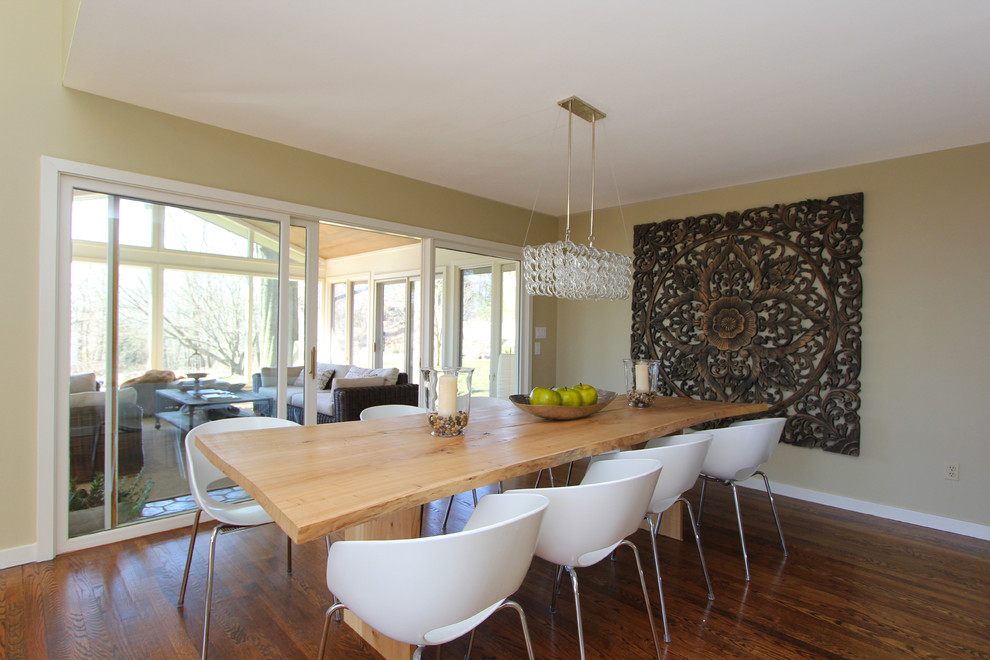 Inspiration for a contemporary dining room in New York with beige walls and dark hardwood flooring.