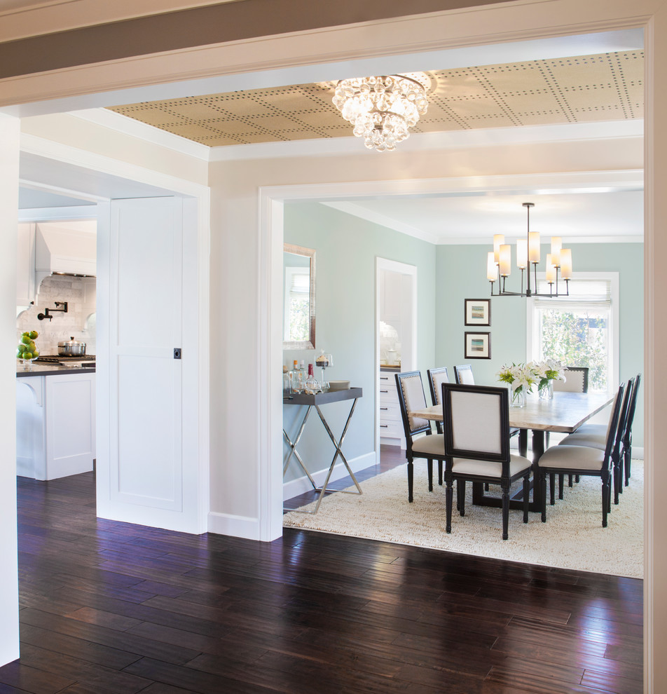 Example of a transitional dark wood floor and brown floor kitchen/dining room combo design in Los Angeles with no fireplace and blue walls