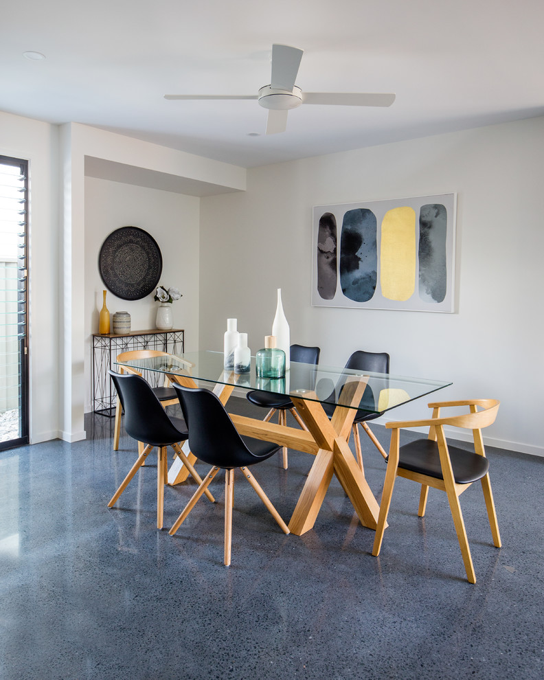 Design ideas for a coastal dining room in Gold Coast - Tweed with white walls and grey floors.