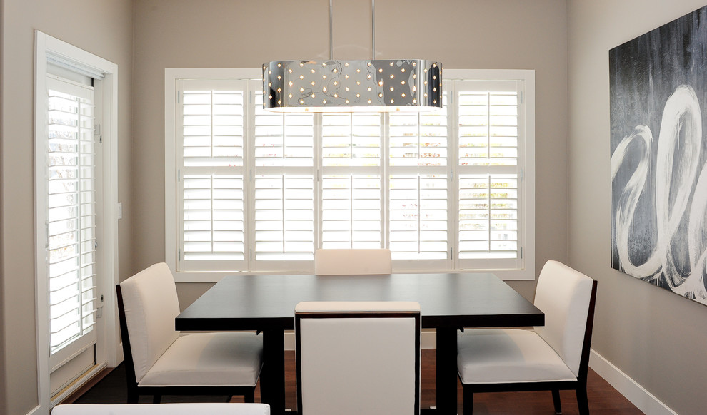 Example of a trendy dining room design in Calgary with gray walls