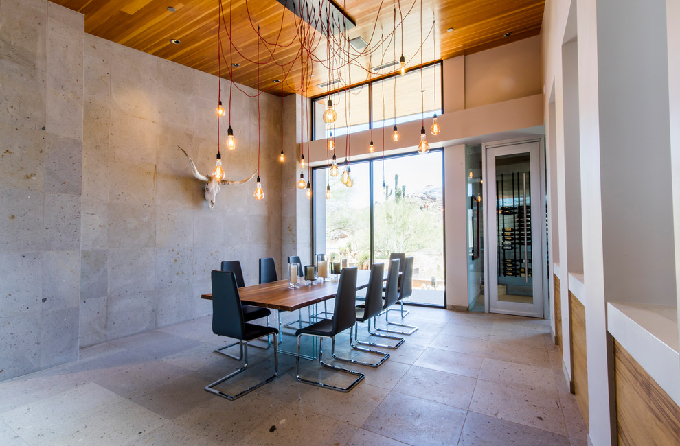 Inspiration pour une grande salle à manger minimaliste fermée avec un mur gris, sol en béton ciré, aucune cheminée et un sol gris.