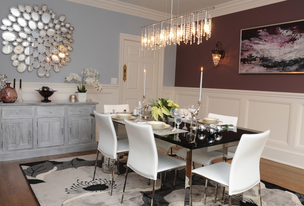 Inspiration for a modern medium tone wood floor enclosed dining room remodel in New York with blue walls