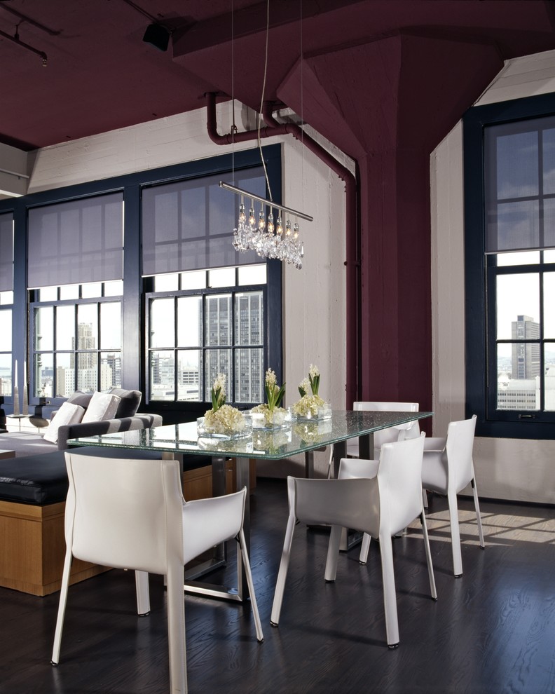 Immagine di una sala da pranzo aperta verso il soggiorno moderna con pavimento grigio