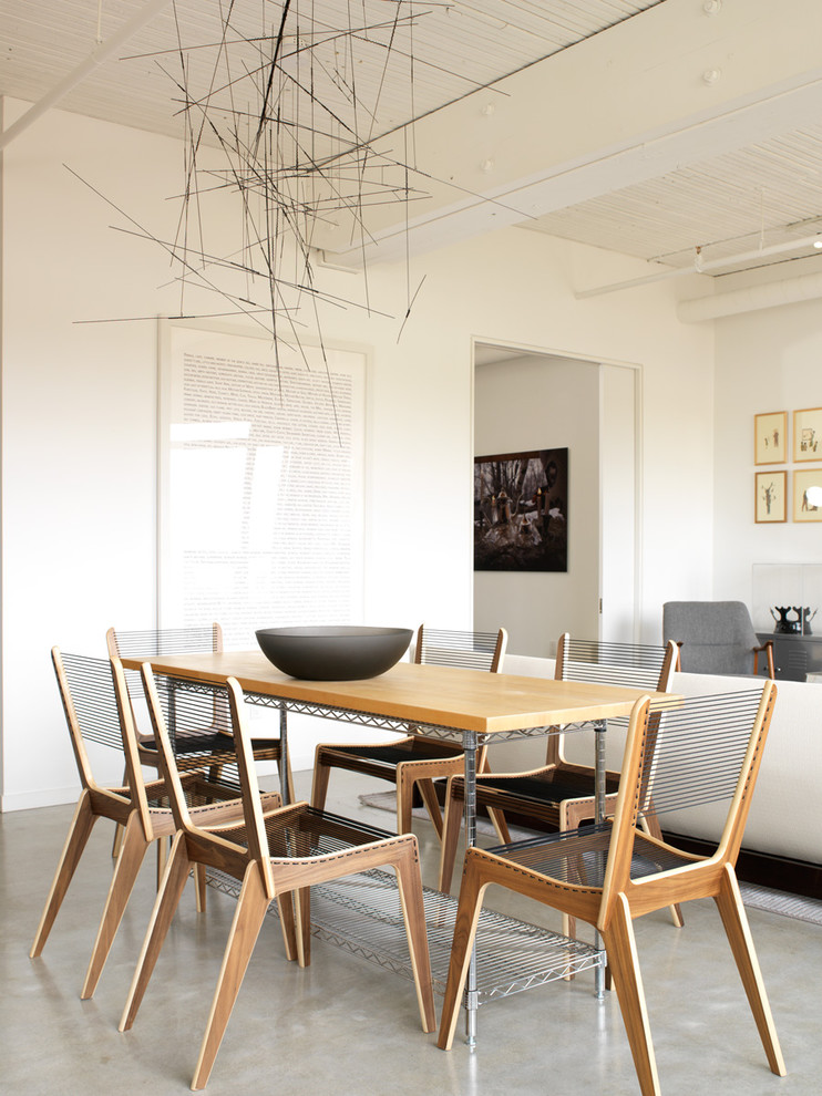 This is an example of an industrial open plan dining room in Toronto.