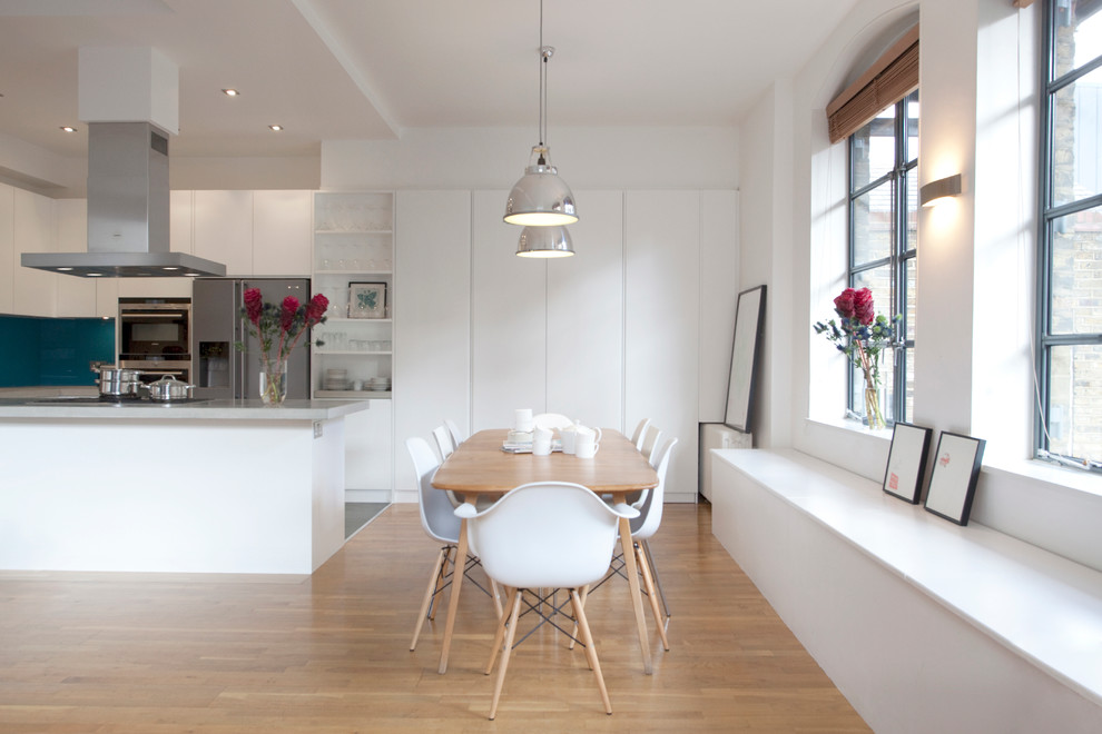 Modern dining room in London with white walls.