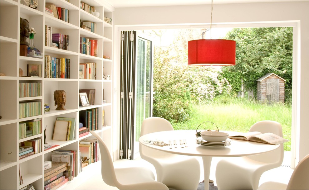 Design ideas for a modern dining room in Berkshire with white walls.