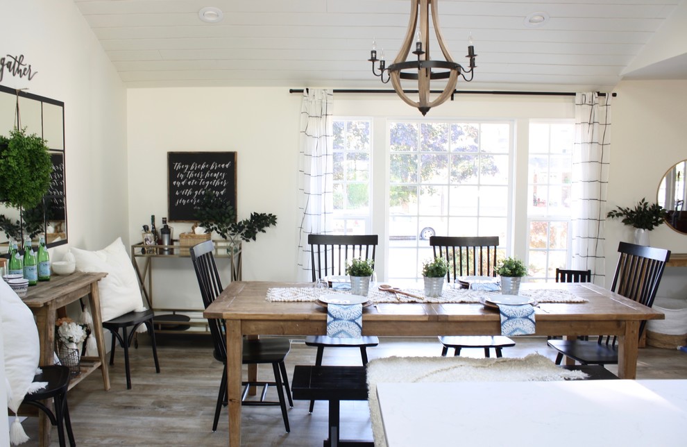 Mid-sized farmhouse vinyl floor and brown floor kitchen/dining room combo photo in Seattle with white walls and no fireplace