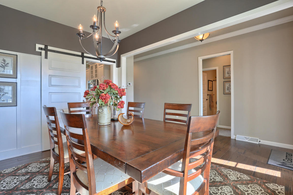 Photo of a medium sized classic enclosed dining room in Philadelphia with brown walls and medium hardwood flooring.
