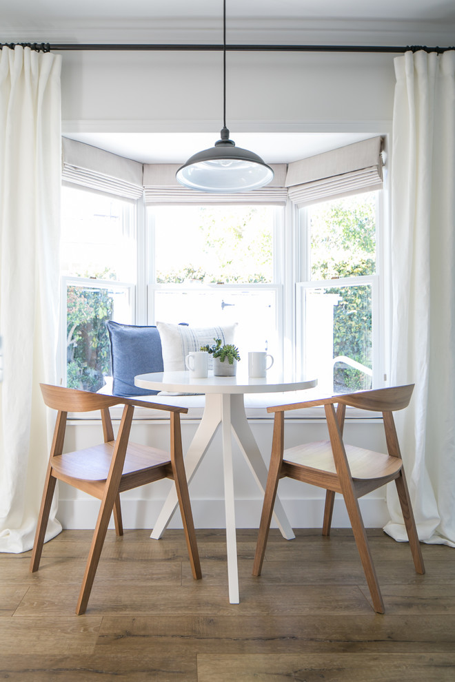 Inspiration for a small farmhouse medium tone wood floor kitchen/dining room combo remodel in Orange County with white walls and no fireplace