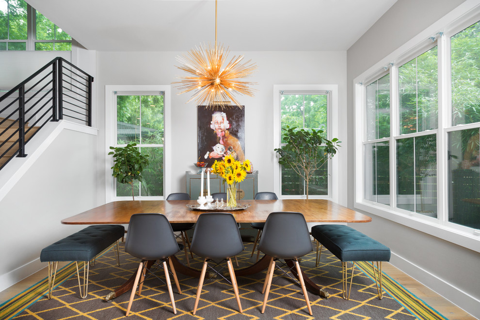 Inspiration for a transitional light wood floor dining room remodel in Austin with gray walls