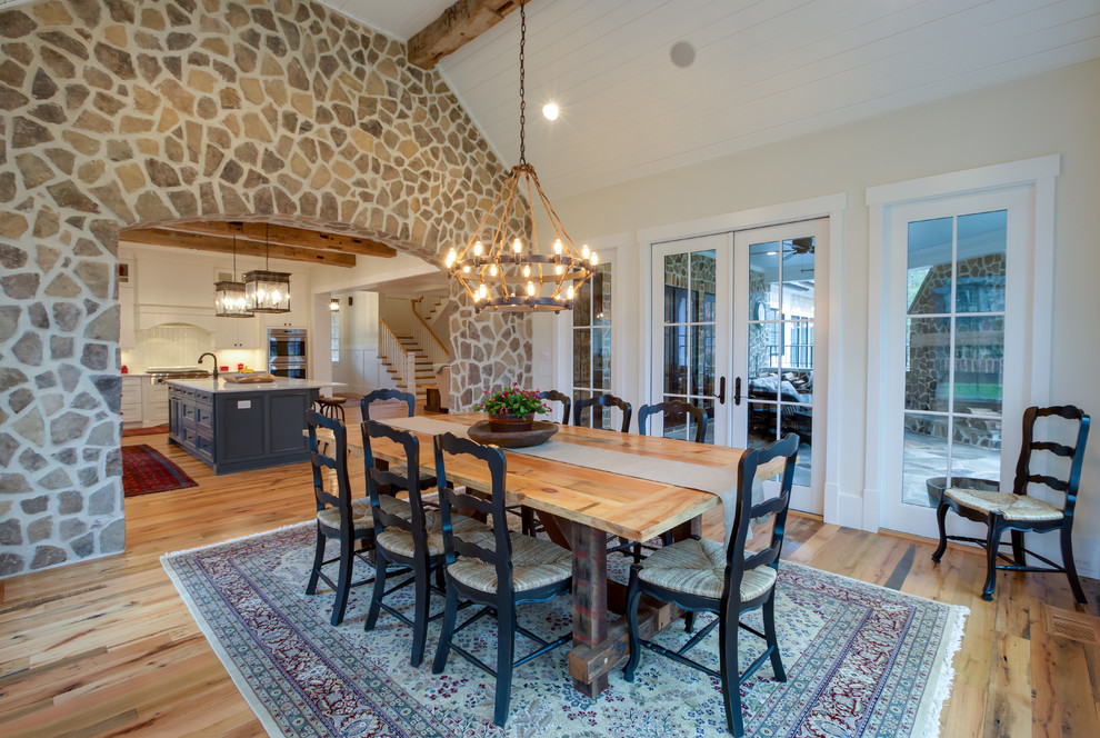 Photo of a large farmhouse enclosed dining room in Charleston with beige walls and light hardwood flooring.