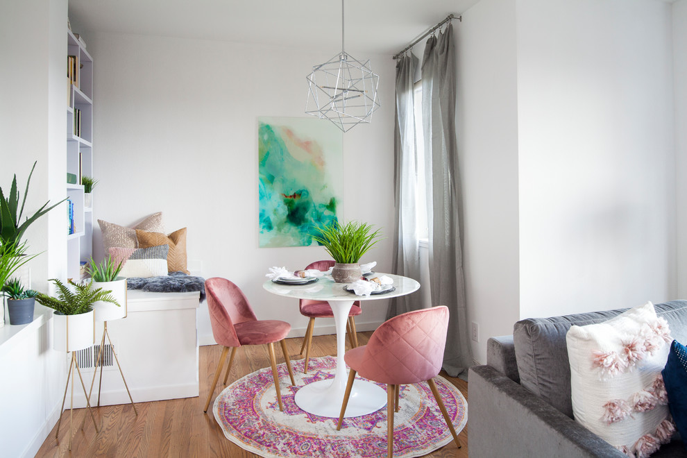 Inspiration for a small contemporary medium tone wood floor and brown floor dining room remodel in San Francisco with white walls