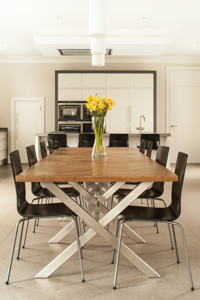 Photo of a contemporary kitchen/dining room in London with beige walls.