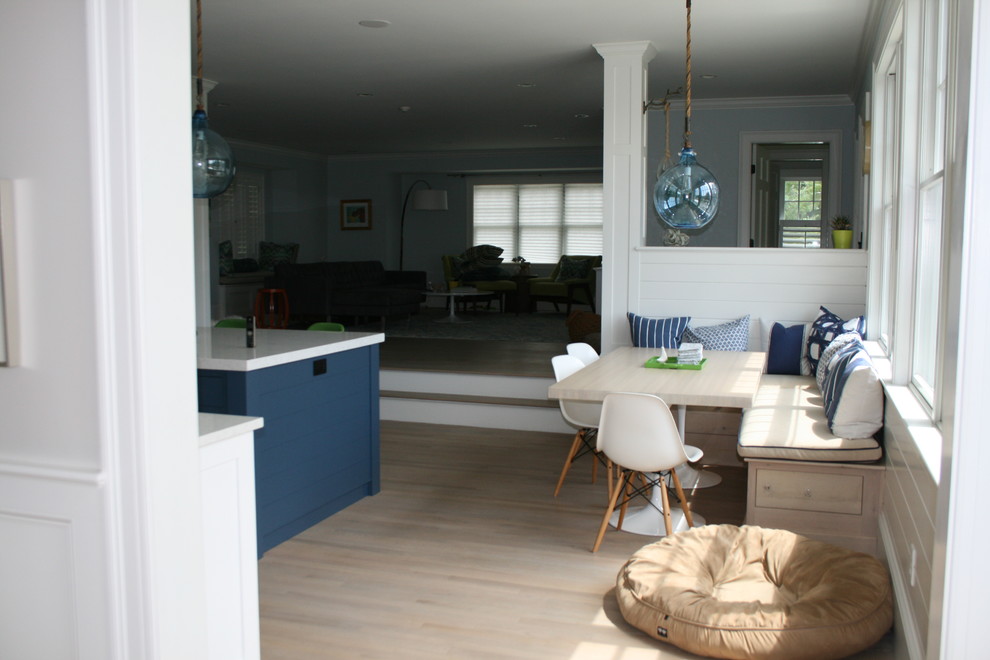 Inspiration for a small classic kitchen/dining room in Manchester with white walls and light hardwood flooring.