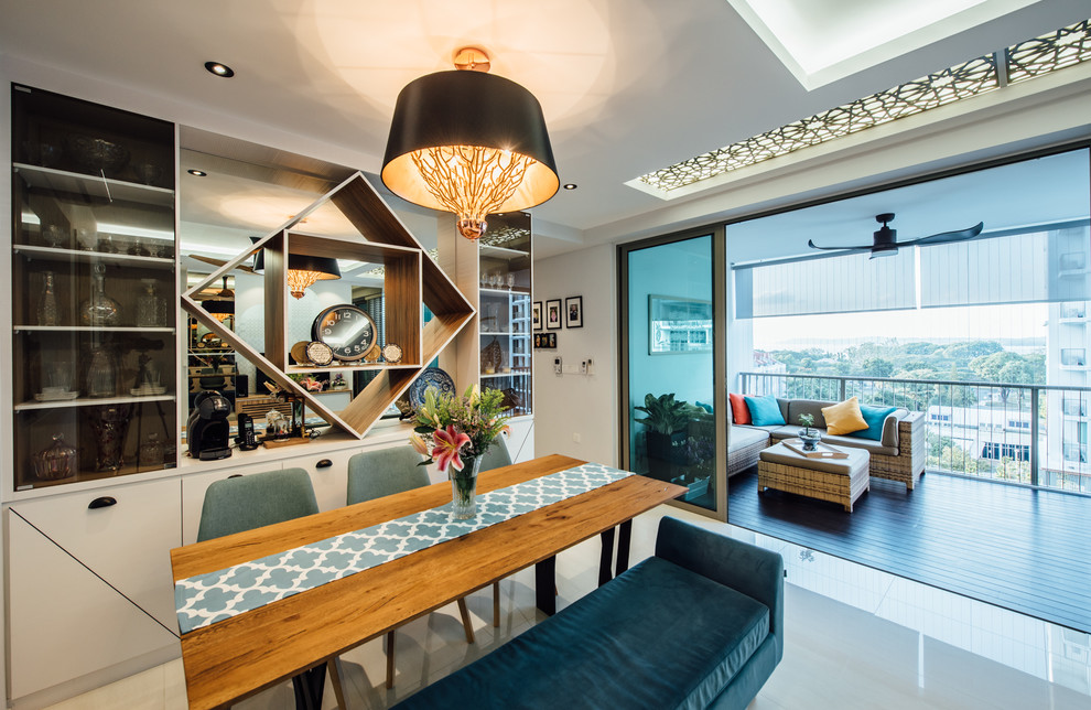 Example of a trendy dining room design in Singapore