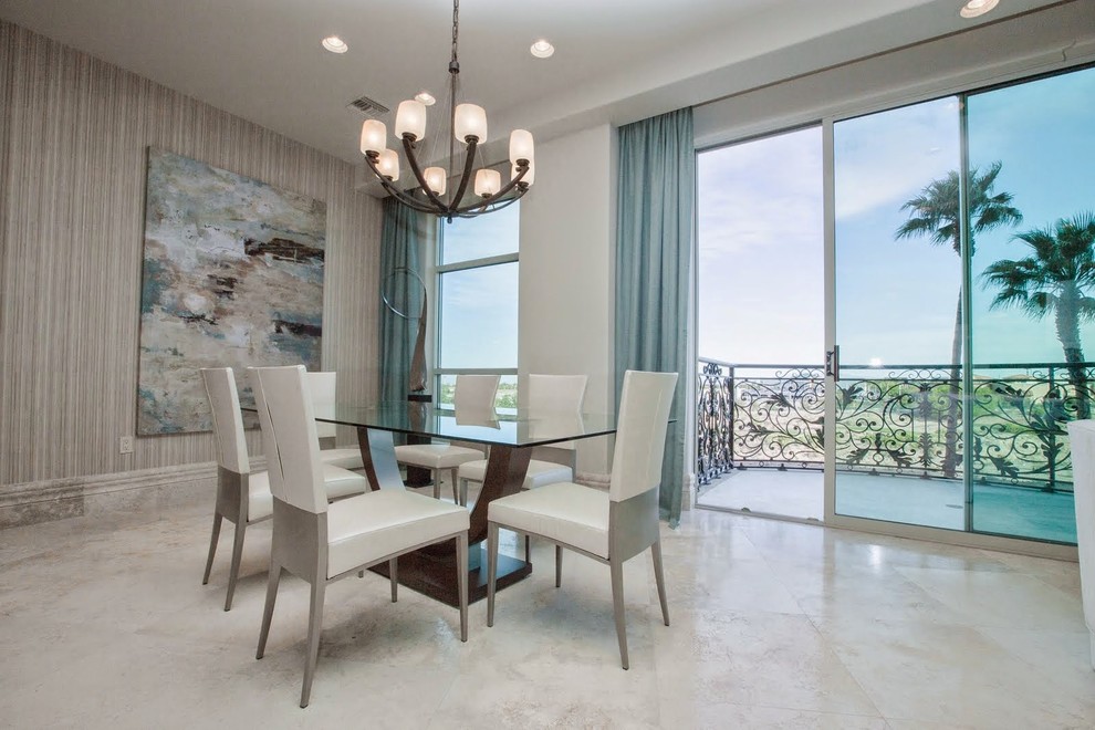Large modern open plan dining room in Las Vegas with white walls, marble flooring and no fireplace.