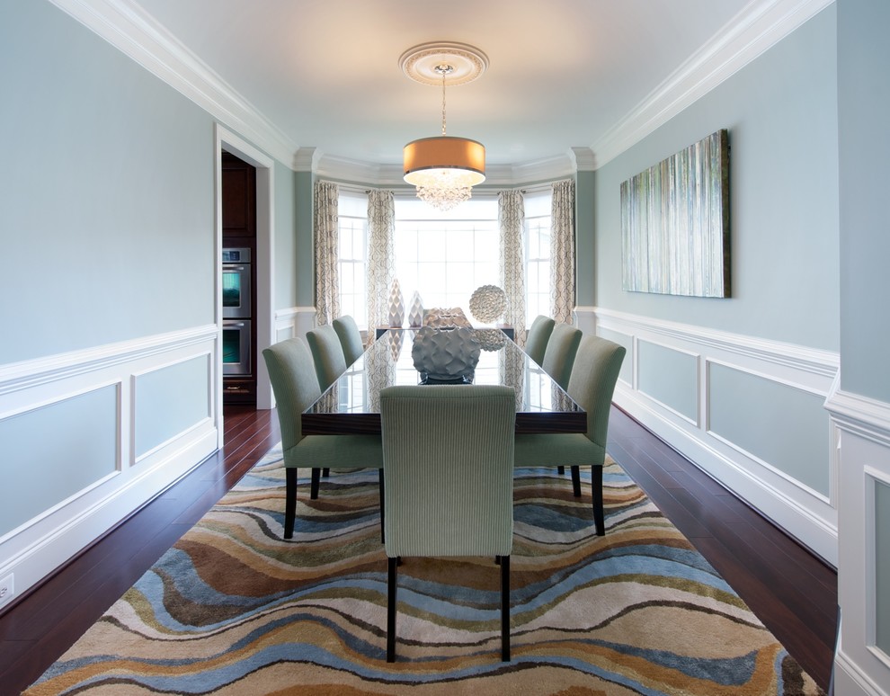 Inspiration for a timeless dark wood floor enclosed dining room remodel in DC Metro with blue walls