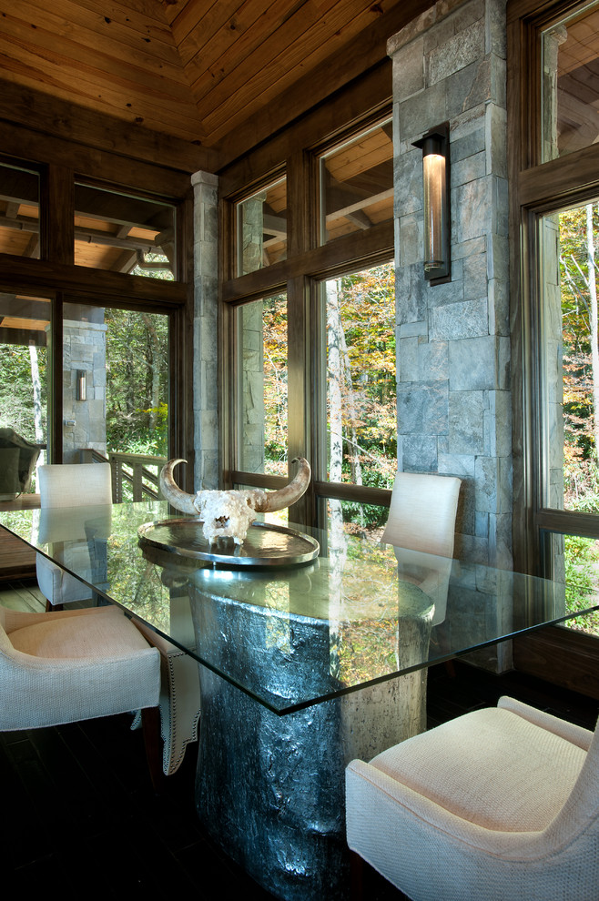 This is an example of a rustic dining room in Charlotte.