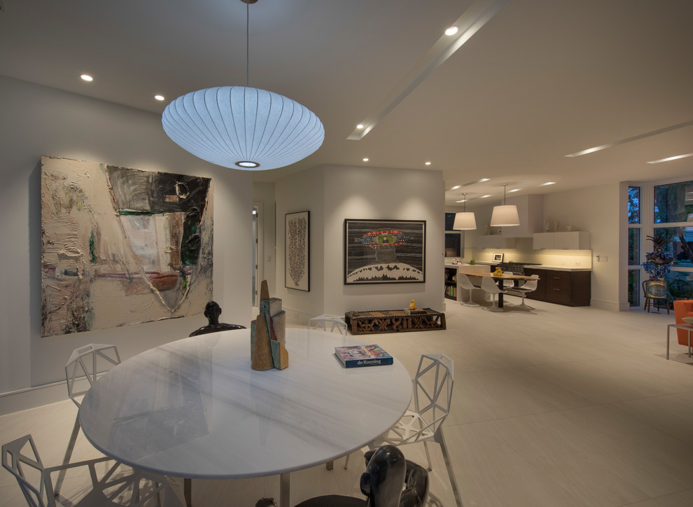 Photo of a medium sized modern dining room in Miami with white floors.