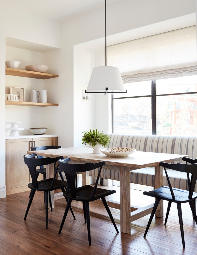 Inspiration for a rural dining room in San Francisco with white walls, medium hardwood flooring and brown floors.