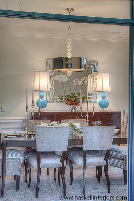 This is an example of a large traditional enclosed dining room in Other with beige walls and light hardwood flooring.