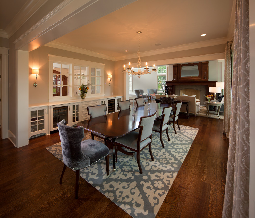 Design ideas for a traditional dining room in Minneapolis with beige walls, dark hardwood flooring and brown floors.