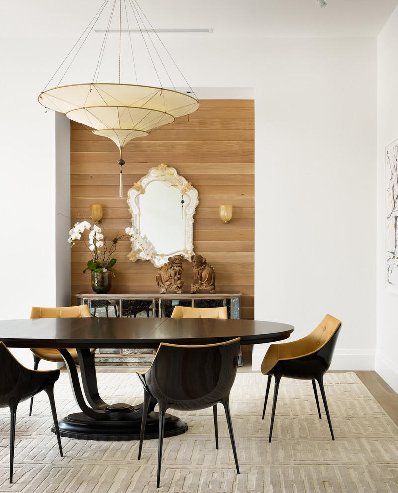 Contemporary dining room in Austin with white walls.