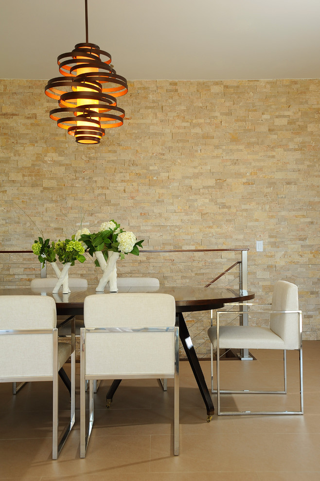 This is an example of a contemporary dining room in Los Angeles with beige walls.