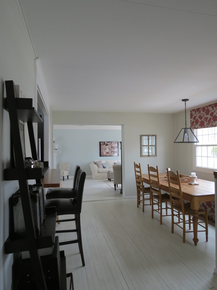 Mid-sized transitional painted wood floor dining room photo in Boston with gray walls