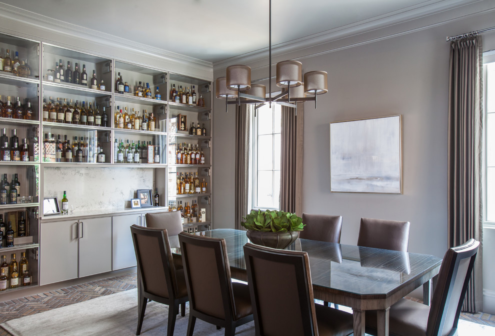 Example of a transitional brick floor dining room design in Houston with gray walls