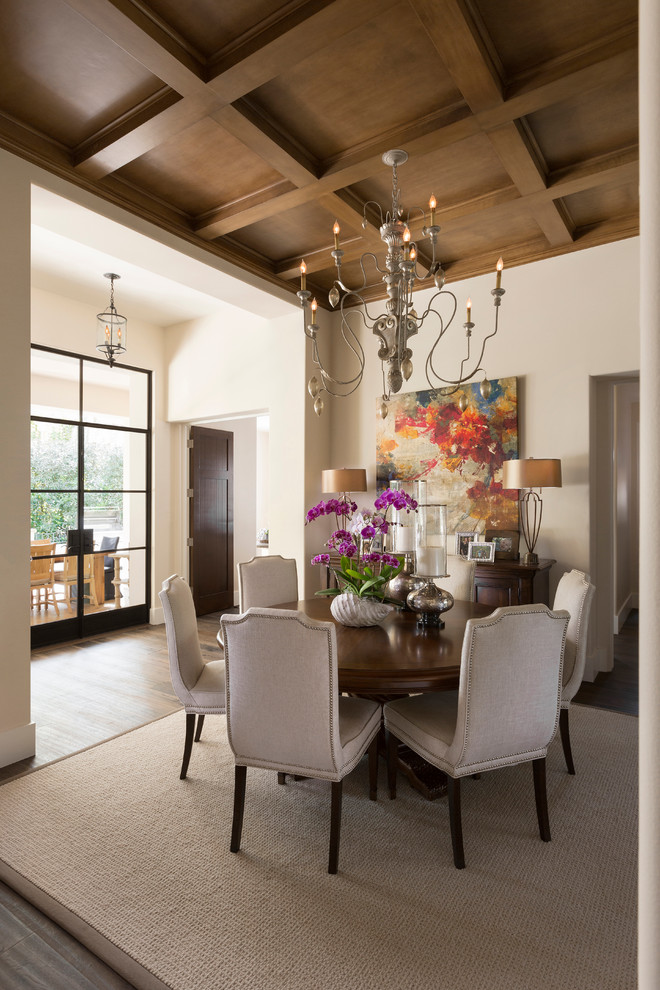 Mid-sized tuscan dark wood floor and brown floor enclosed dining room photo in Other with beige walls and no fireplace