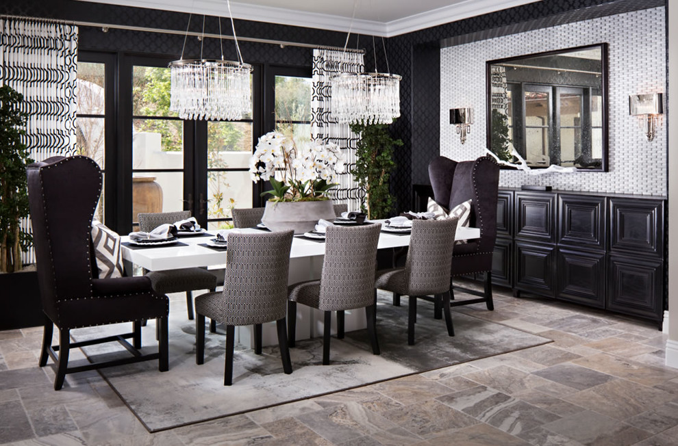 Immagine di una grande sala da pranzo aperta verso la cucina minimal con pareti nere e pavimento in pietra calcarea