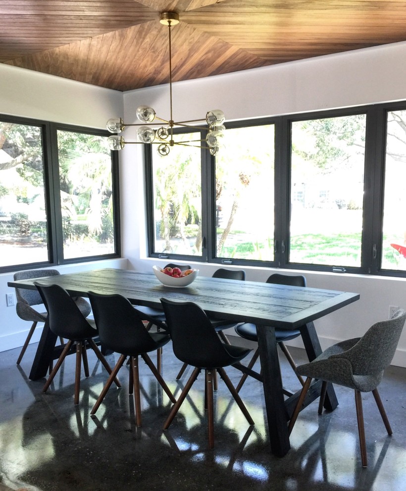 Design ideas for a medium sized midcentury enclosed dining room in Tampa with white walls, concrete flooring, no fireplace and white floors.